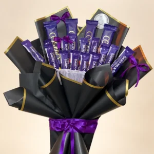Dairy Milk and Cosmo chocolate bouquet in black sheets with gold edging and purple ribbons