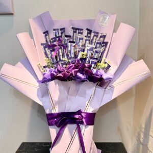 30 Cadbury chocolates with purple satin roses in a blush bouquet